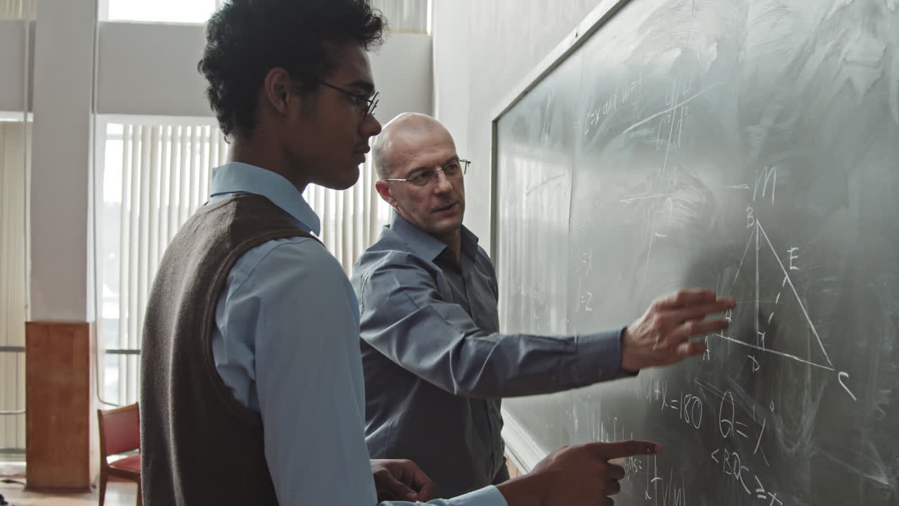 Professor Helping Student to Solve Geometry Problem