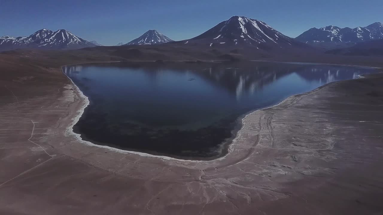 Lake Meniques on Los Flamencos National Reserve and Chile volcanos in the background, Antofagasta Region, Bolivia