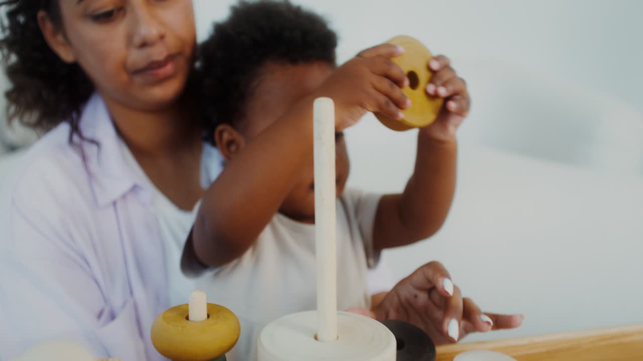 Mother and Child Playing with Wooden Toys