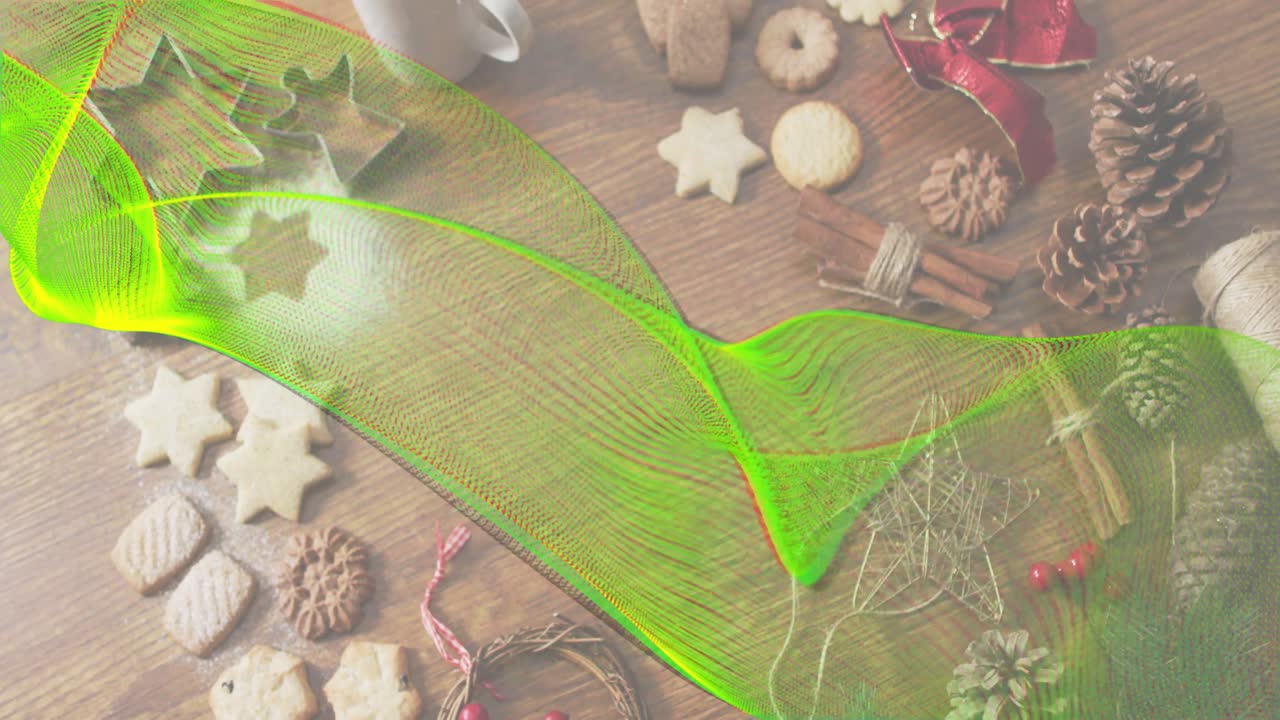 Neon green ribbon emerging at left sweeping across holiday baking spread revealing decorations