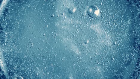 oxygen bubbles in water on a blue abstract background