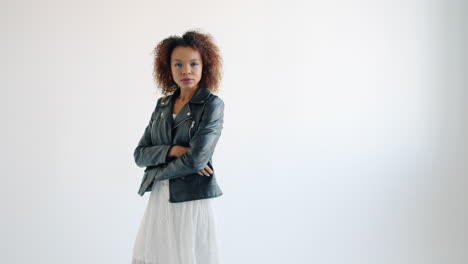 stylish woman in leather jacket and dress
