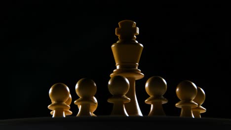 Cinematic-shot-of-a-white-king-chess-piece-with-the-pawns-surrounding-it