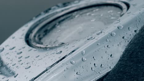 close view speedometer surface covered with drops after rain