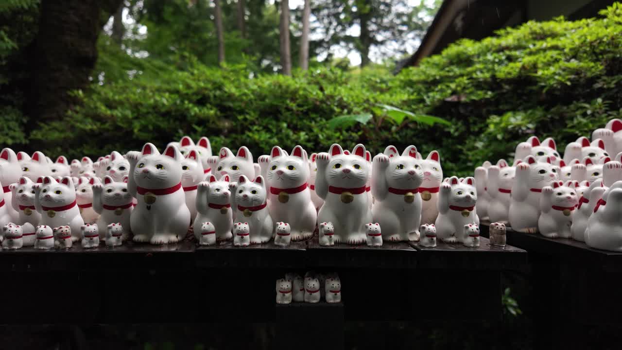Lucky cat charm gift shop figurines Gotokuji Temple Tokyo Maneki-neko Japan