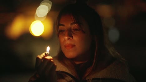 serene woman holding a lit match in soft twilight ambiance