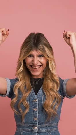 excited transgender woman with clenched fists celebrating victory
