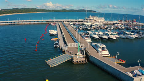 Drone flying above the Sopot&#039;s marina with moored luxurious yachts and motorboats at sunny summer day