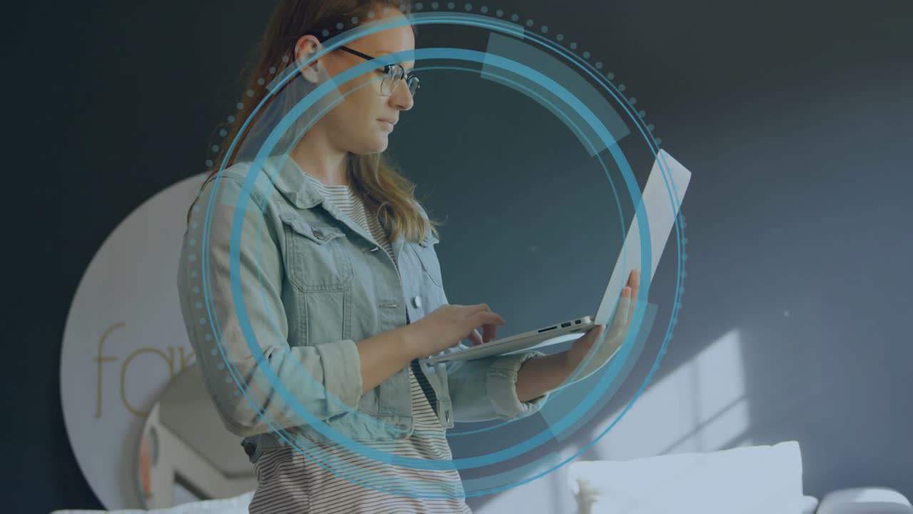 Mid-adult woman typing on laptop while concentric circles forming into tech HUD for productivity