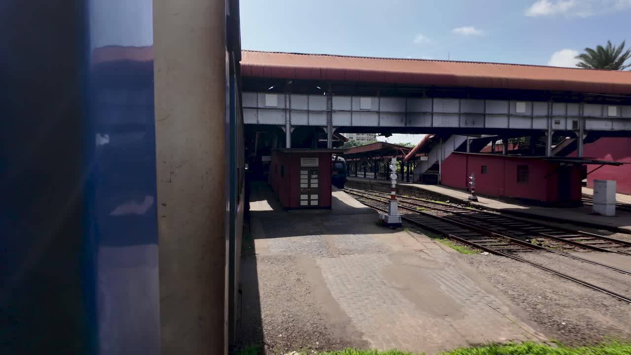 Passenger point of view from a moving train approaching colombo fort railway station in sri lanka