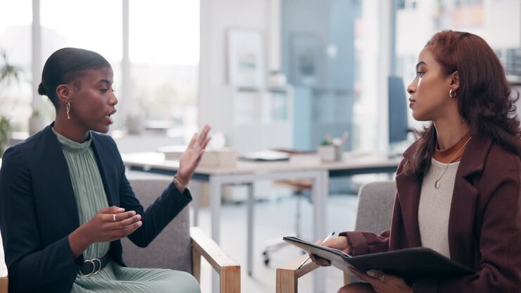 Businesswomen in Conversation at Office