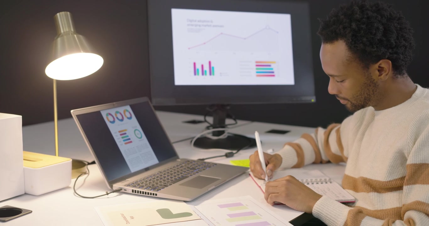 Professional Man Analyzing Financial Data at His Desk