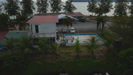 fpv drone view of seafront villas in marina island, malaysia