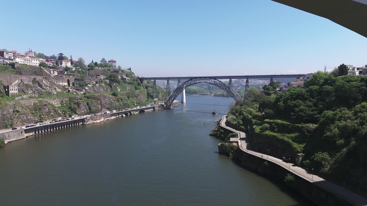 Fly under The Infante Dom Henrique Bridge towards Luís I Bridge in Porto, Portugal