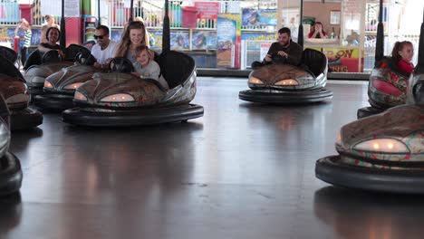 people enjoying bumper cars at a fair