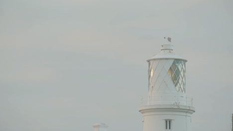 close up view of lighthouse on cloudy evening