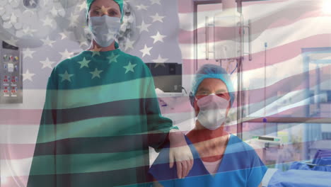 animation of flag of usa over diverse surgeons in face masks