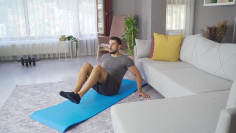 mid adult fitness man exercising at home.