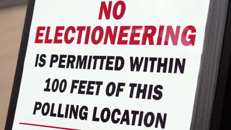 No-Electioneering-is-Permitted-Within-100-Feet-of-this-Polling-Location-Sign-Close-Up-with-Sun-Glair