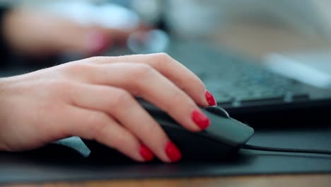 close up of corporate business lady keyboard typing and mouse scrolling in a office enviroment