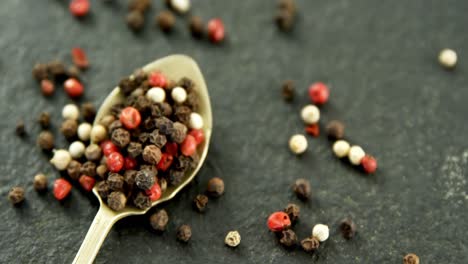 black pepper on concrete background 4k