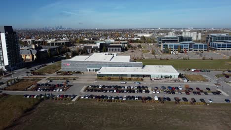 drone shot of the ymca sports facility in quarry park community in calgary, on a beautiful sunny day