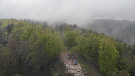 People-at-Zeller-Horn-Viewpoint,-located-on-the-top-of-a-hill-in-the-Black-Forest,-during-foggy-and-cloudy-day