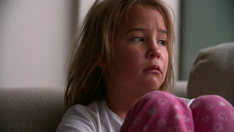 close up portrait of crying child looking at camera