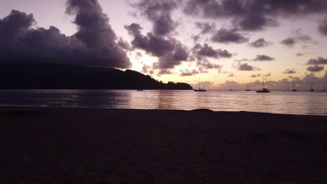 gimbal slow panning shot of the picturesque beach at hanalei bay during sunset on the hawaiian island of kaua'i