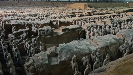 collection of terracotta army - clay figures of warriors in mausoleum of the first qin emperor in china. - pan shot