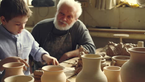 grandfather and grandson pottery workshop