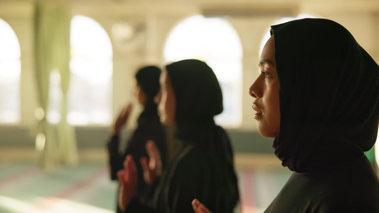 Muslim women praying in a mosque