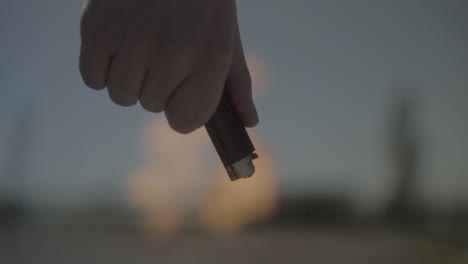 hand holding a lighter