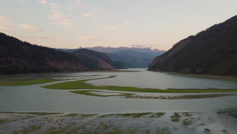 Aerial-Drone-Sunset-Light-Slow-Moving-Panning-Shot-of-Soo-River-in-Pacific-Mountain-Ranges-British-Columbia-Canada-4K