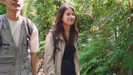 couple hiking in a lush forest