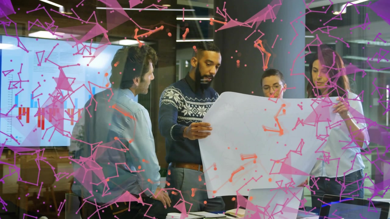Man in sweater unfolding blueprint while team pointing at animated business chart during planning