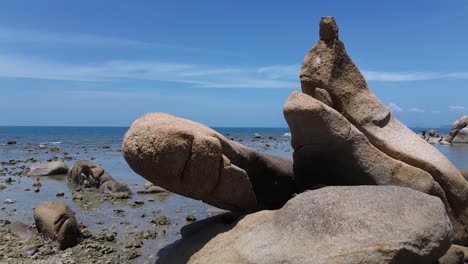aerial drone footage of lamai beach in koh samui, thailand, featuring turquoise ocean, rocky shoreline, tropical island horizon, and scenic coastal landscape under clear tropical skies