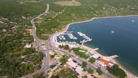 aerial drone footage of the medieval krk old and and marina in krk island in the adriatic sea in croatia at sunset