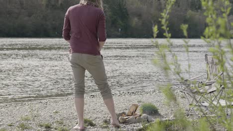 preparing-the-bonfire-next-to-the-beautiful-and-shimmering-danube-river