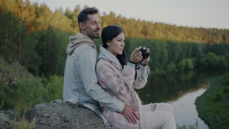 couple taking pictures in nature
