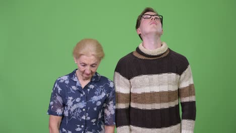 grandmother looking down and grandson looking up together