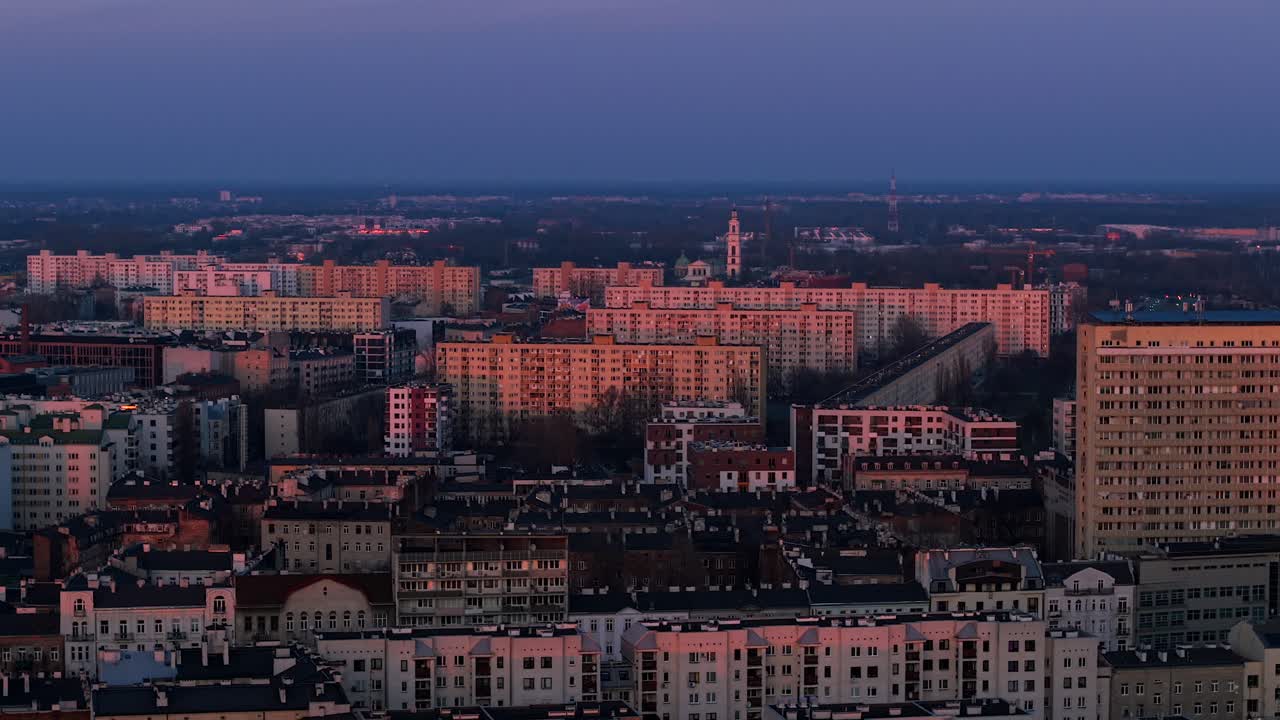 Aerial sunset drone tracking right across Warsaw Praga district, Poland, old residential buildings