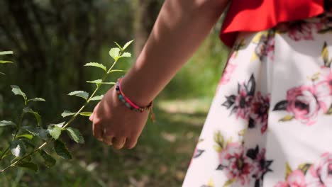 Close-up-view-of-a-young-woman-wearing-a-pretty-flower-pattern-dress