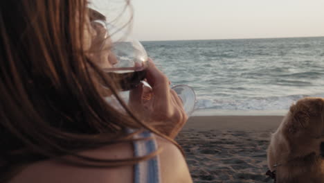 clinking wine glasses on ocean shore