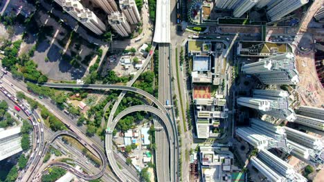 Hong-Kong-Downtown-Kowloon-Stadtgebiet,-Von-Oben-Nach-Unten-Luftaufnahme-Mit-Verkehr-Und-Wolkenkratzern-Der-Stadt