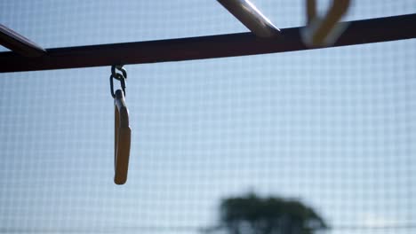 slow motion, metal handle on playground equipment