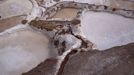 maras salt mines ponds in sacred valley of the incas, andes mountains, cusco, peru