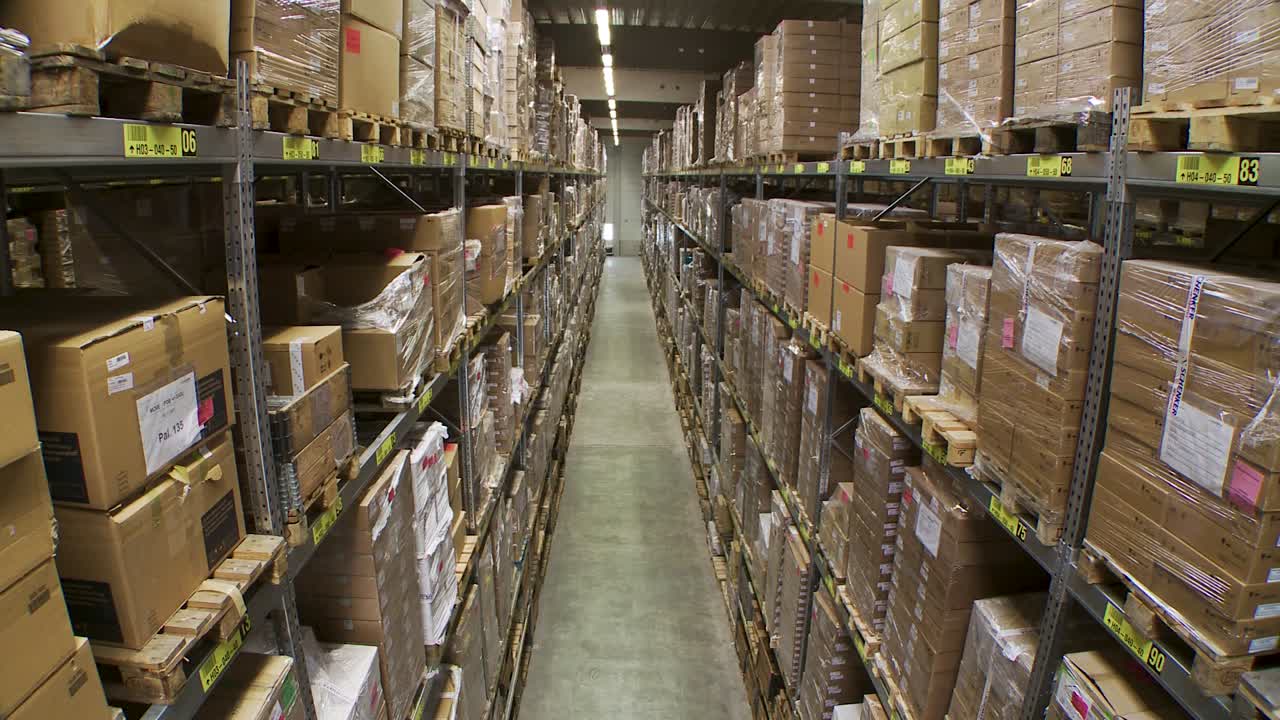 Inside a Large Warehouse with Many Pallets of Boxes