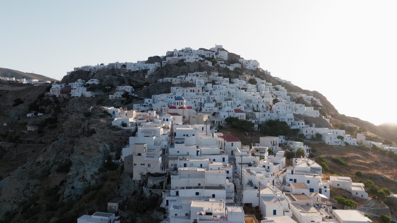 Panoramic drone shot of Serifos island Chora, Cyclades islands, Aegean sea at sunrise