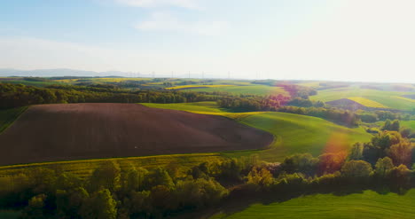 Beautiful-Agricultural-Landscape-Against-Ecological-Windmills-Farm